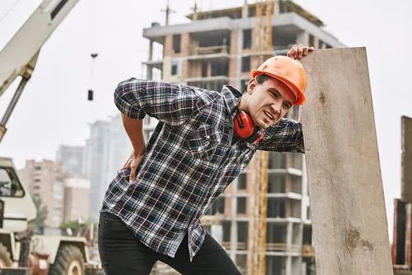 Construction Worker Holding Hurt Back