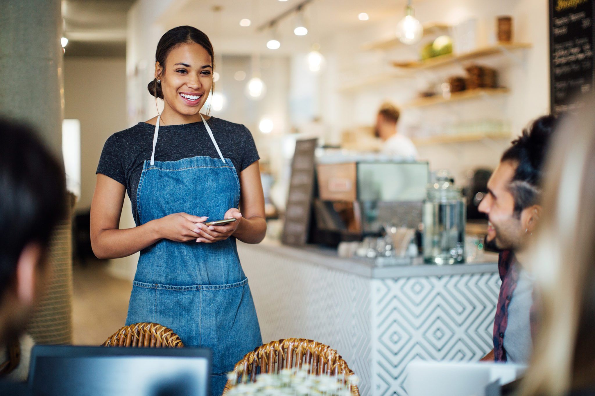 Waitress happy her work has restaurant insurance